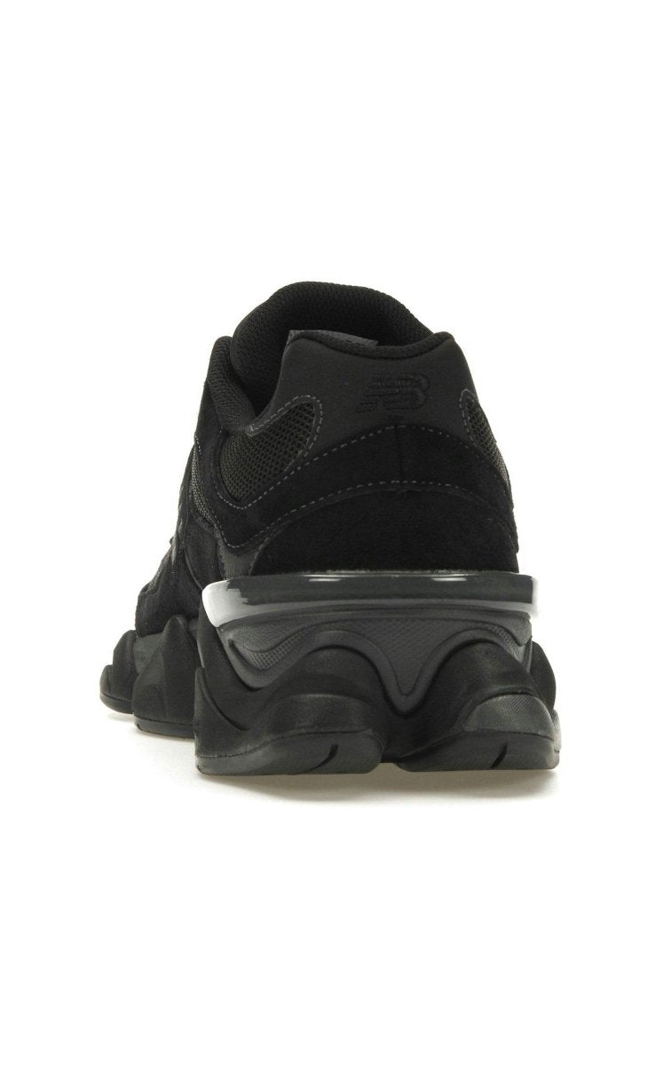 New Balance 9060 Black sneaker rear view, featuring a mix of suede and mesh for style and comfort.