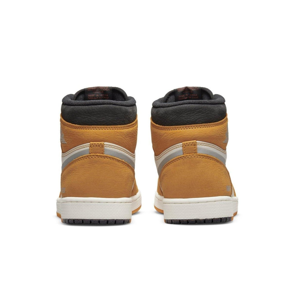 Rear view of Jordan 1 High Element Gore-Tex Light Curry sneakers featuring curry accents and Gore-Tex materials.