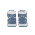 Rear view of Jordan 1 High OG Denim women's sneakers featuring a light blue denim and white leather design.