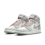 Air Jordan 1 High OG Seafoam sneakers in green and white with brown laces, perfect for collectors and sneaker enthusiasts.