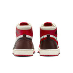 Back view of women's Jordan 1 High Zoom Comfort 2 Teyana Taylor sneaker featuring red and chocolate brown design.