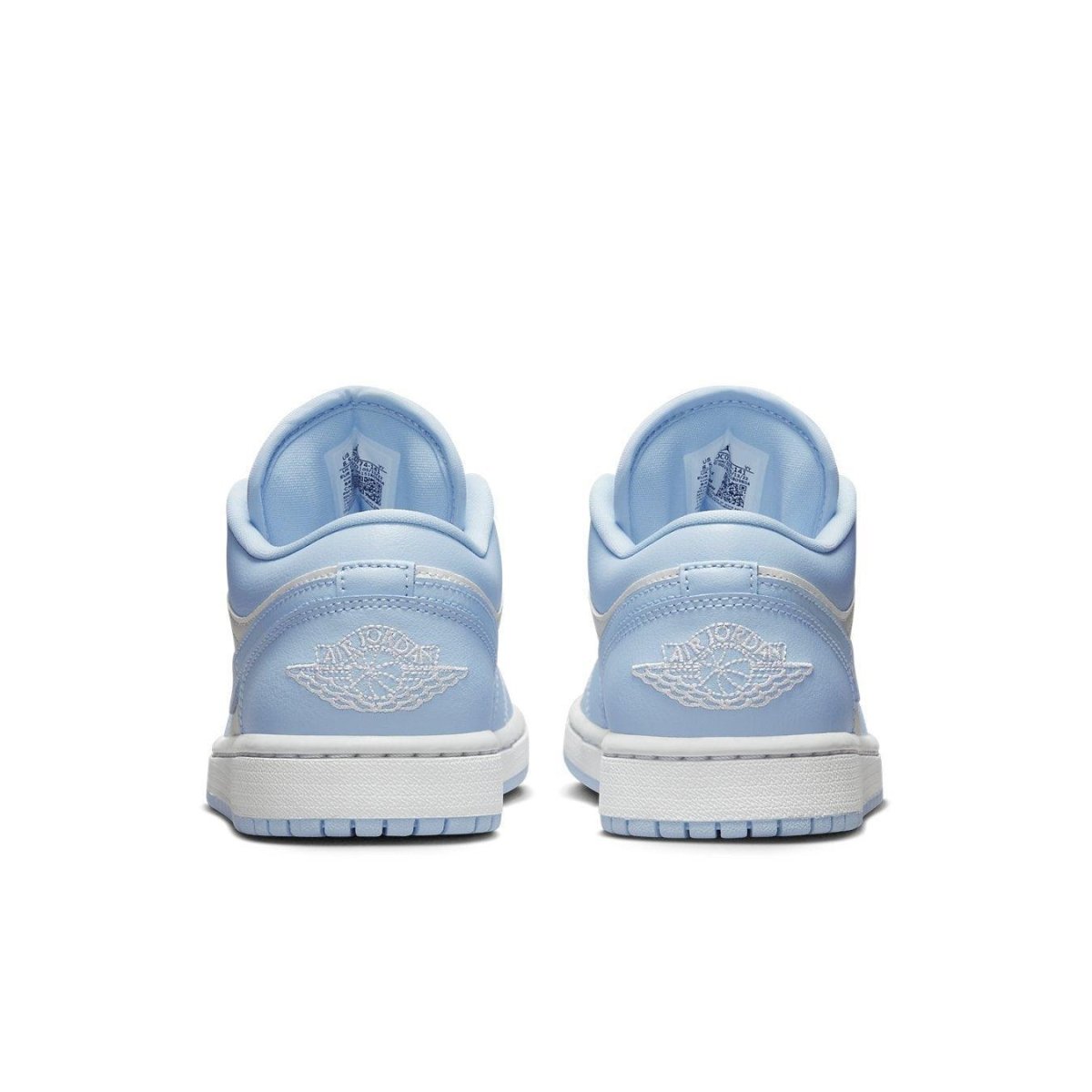 Jordan 1 Low Aluminum Women's sneakers, featuring a light blue back view and signature Jordan branding.