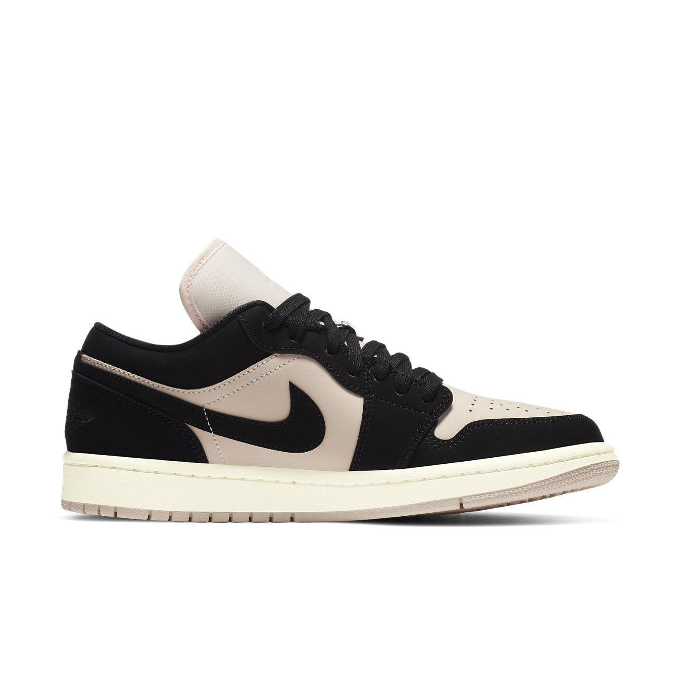 Jordan 1 Low Black Guava Ice (W) featuring black and beige suede with a sleek design for stylish comfort.
