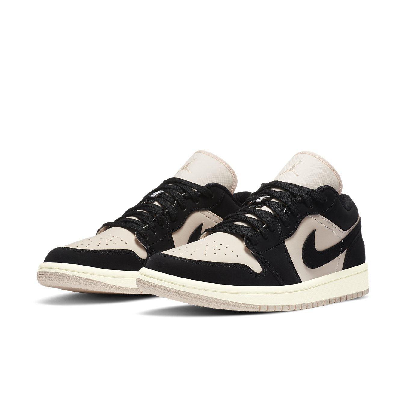 Jordan 1 Low Black Guava Ice (W) in black and beige suede, featuring a sleek design and stylish layers.