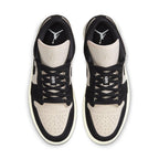 Jordan 1 Low Black Guava Ice (W) featuring black and beige suede design with iconic Air Jordan branding.