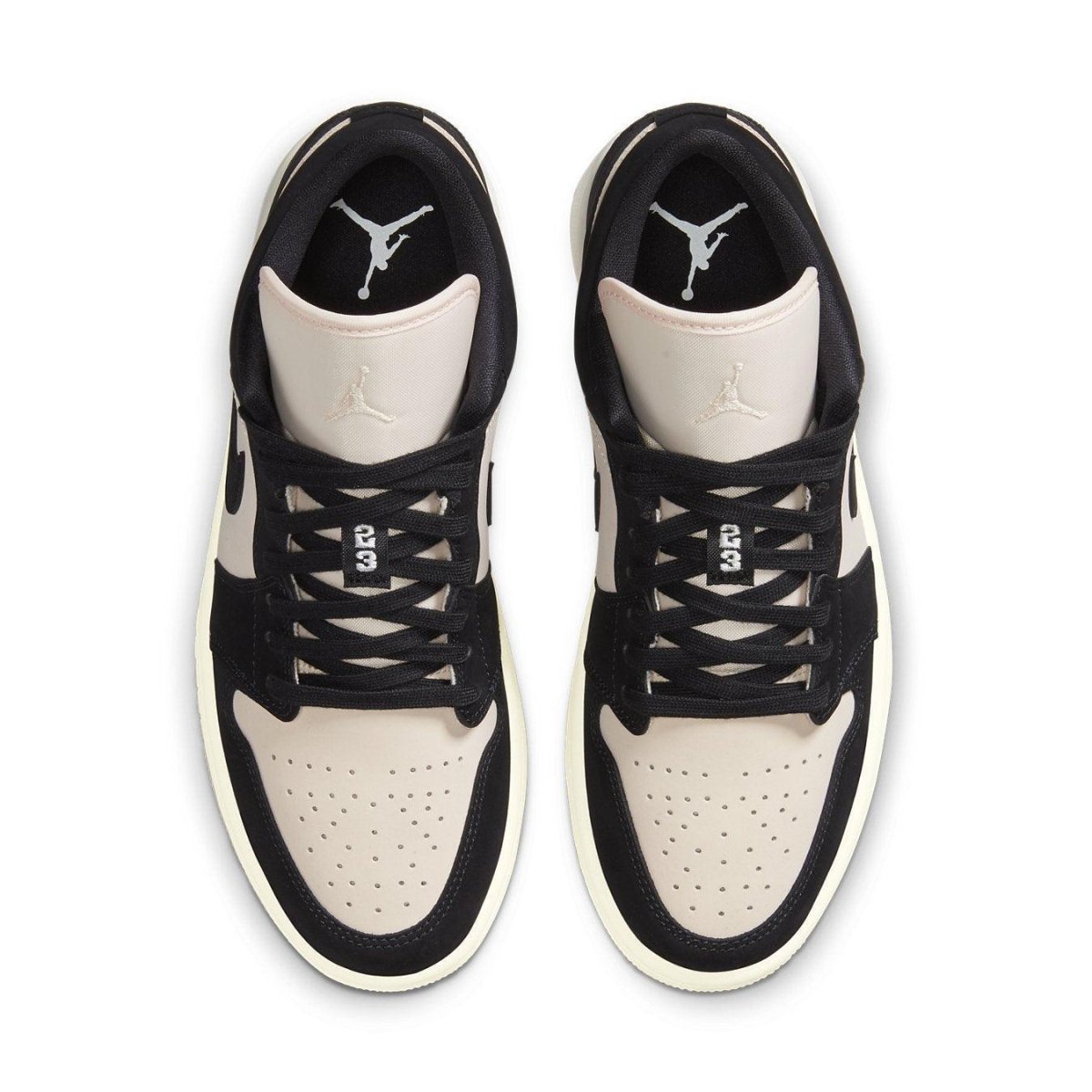 Jordan 1 Low Black Guava Ice (W) featuring black and beige suede design with iconic Air Jordan branding.