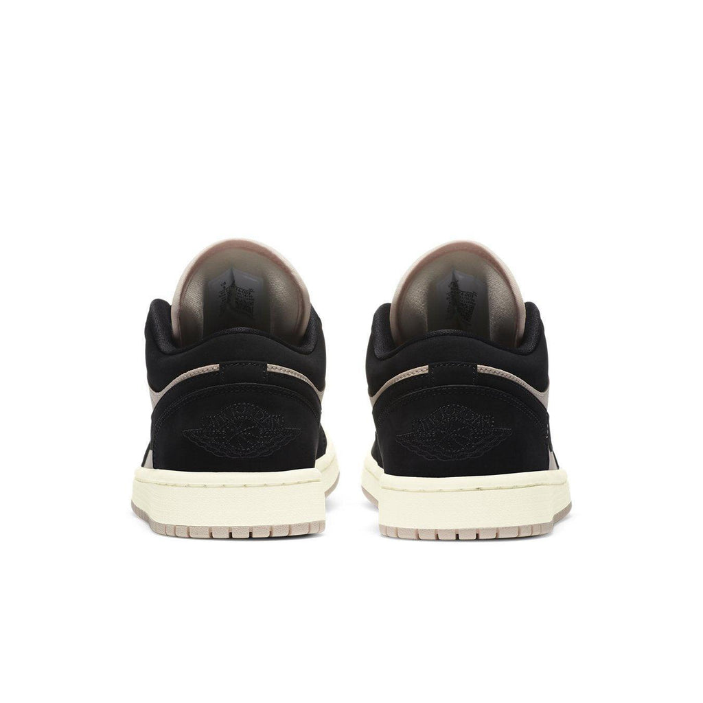Jordan 1 Low Black Guava Ice (W) rear view showcasing black and beige suede with signature logo detail.