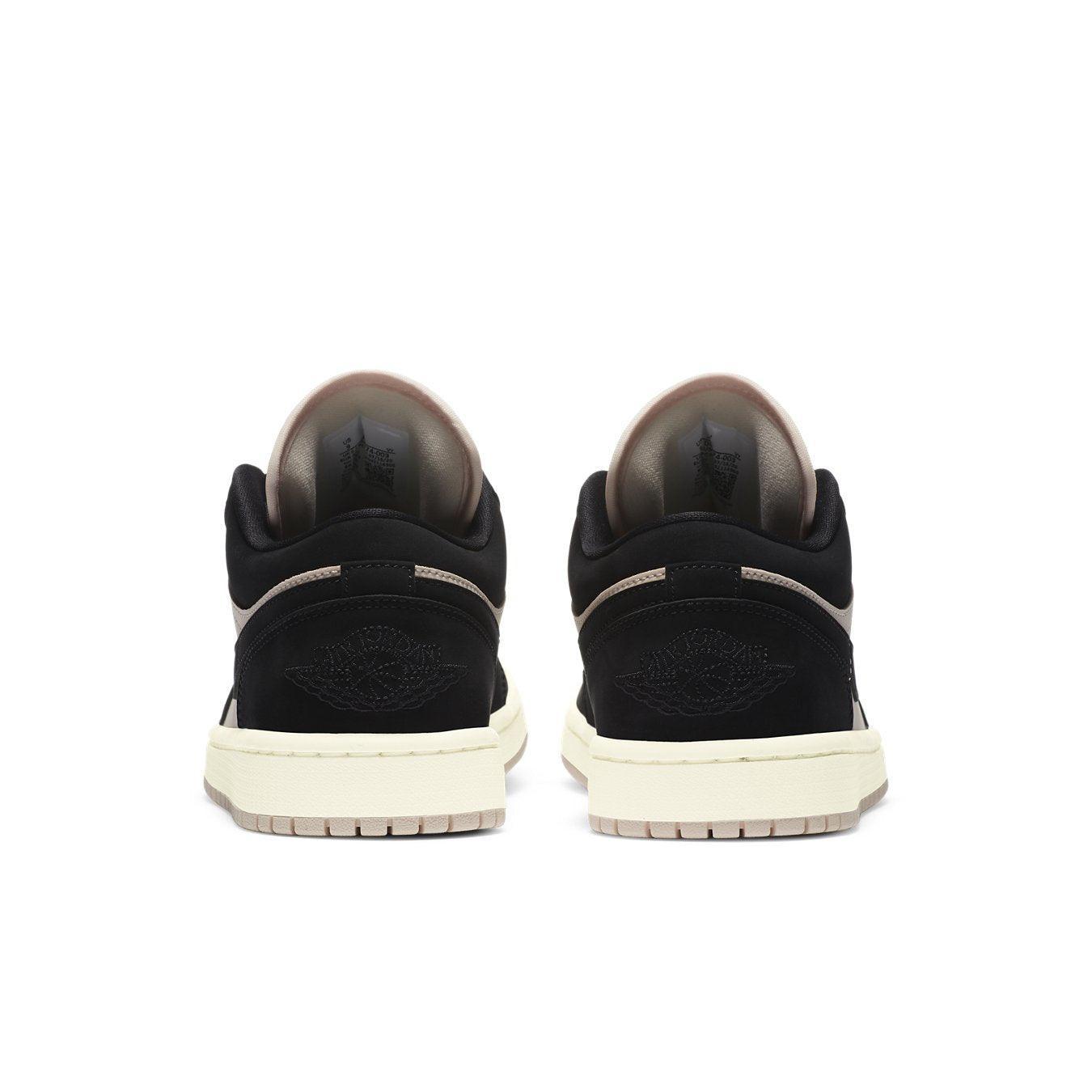 Jordan 1 Low Black Guava Ice (W) rear view showcasing black and beige suede with signature logo detail.