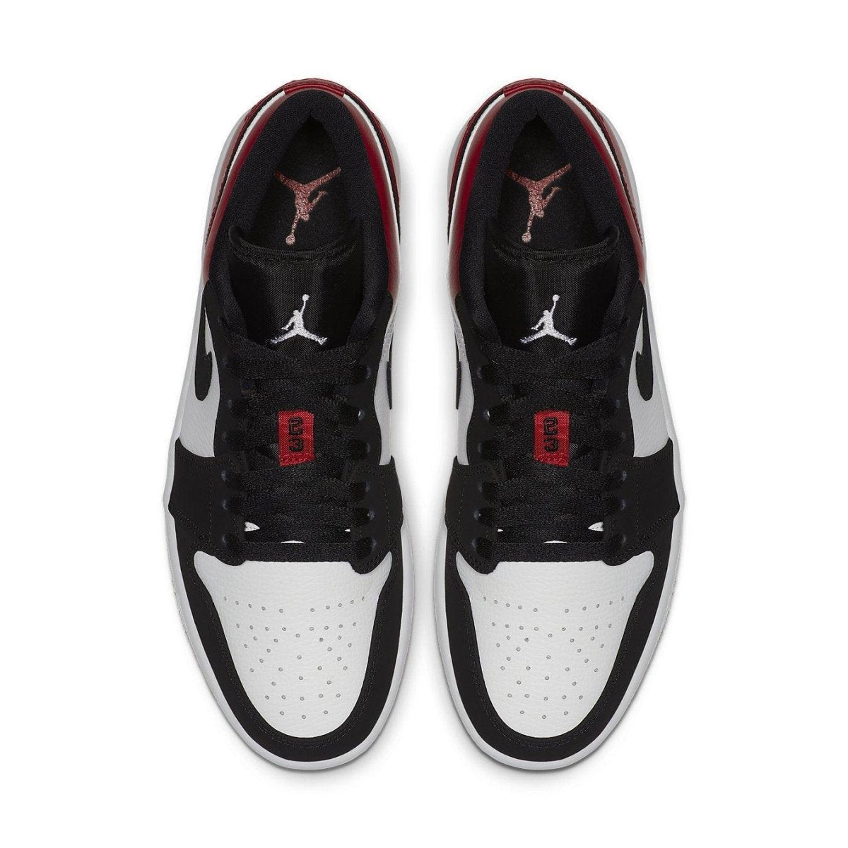 Top view of Jordan 1 Low Black Toe sneakers with black, white, and red accents.