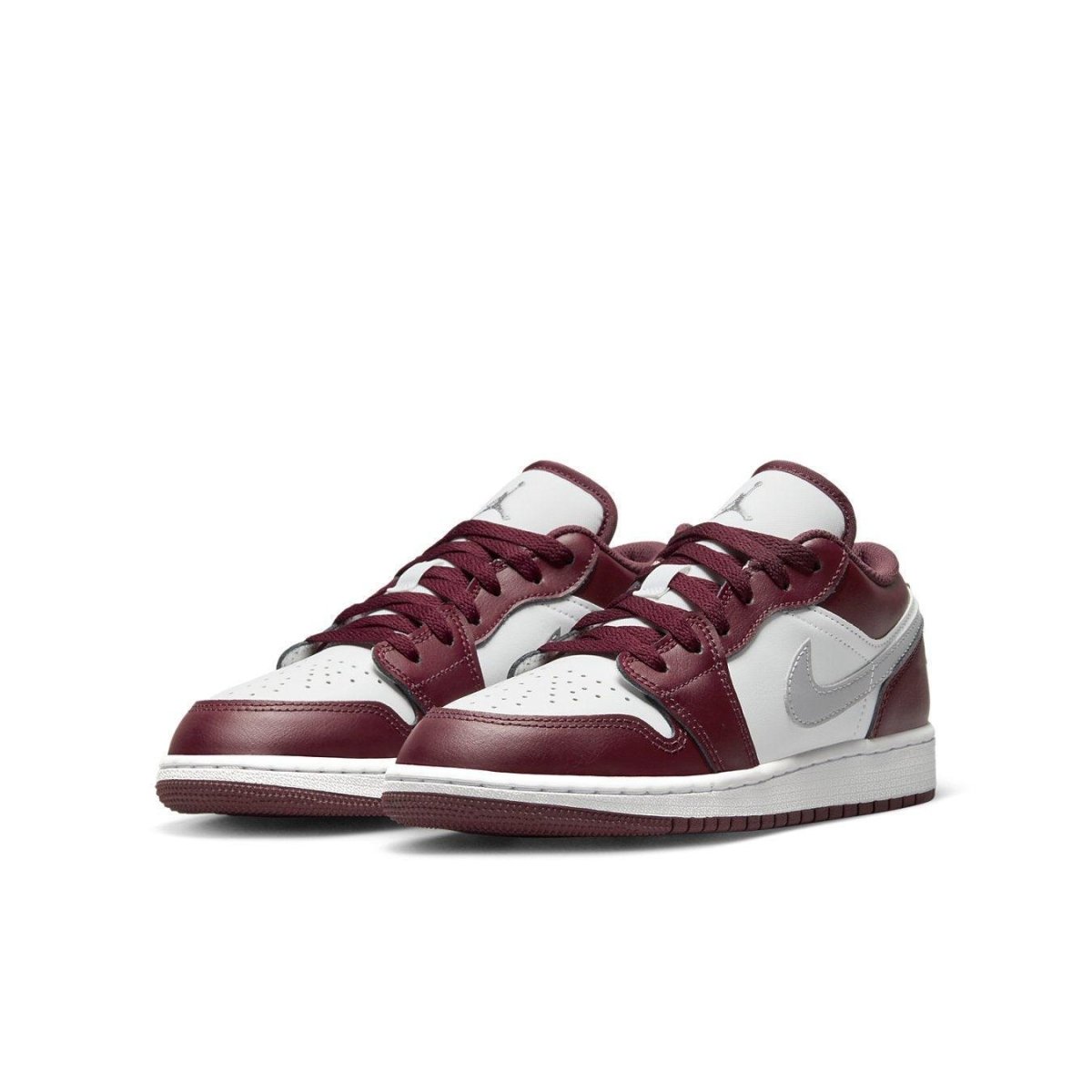 Air Jordan 1 Low Bordeaux GS shoes in burgundy and white with a stylish design and Nike Swoosh.