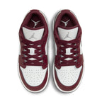 Top view of Air Jordan 1 Low Bordeaux GS sneakers featuring leather upper, iconic Swoosh, and Air cushioning.