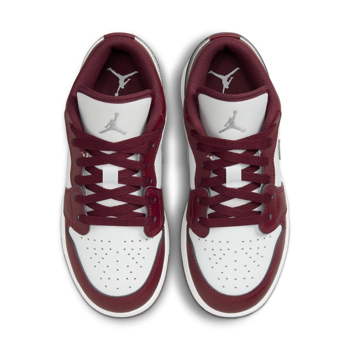 Top view of Air Jordan 1 Low Bordeaux GS sneakers featuring leather upper, iconic Swoosh, and Air cushioning.