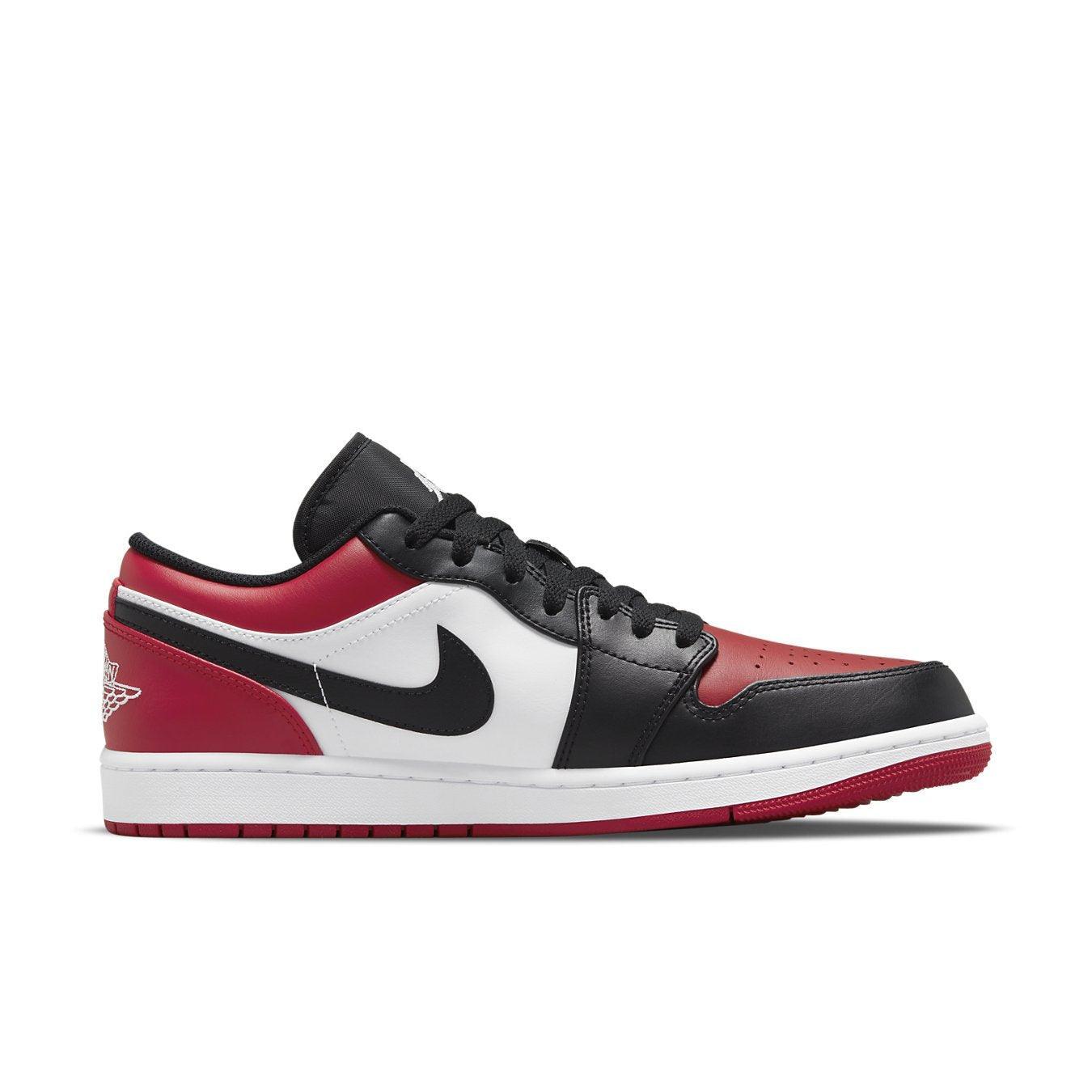 Jordan 1 Low Bred Toe sneaker featuring black, white, and red leather color blocking.