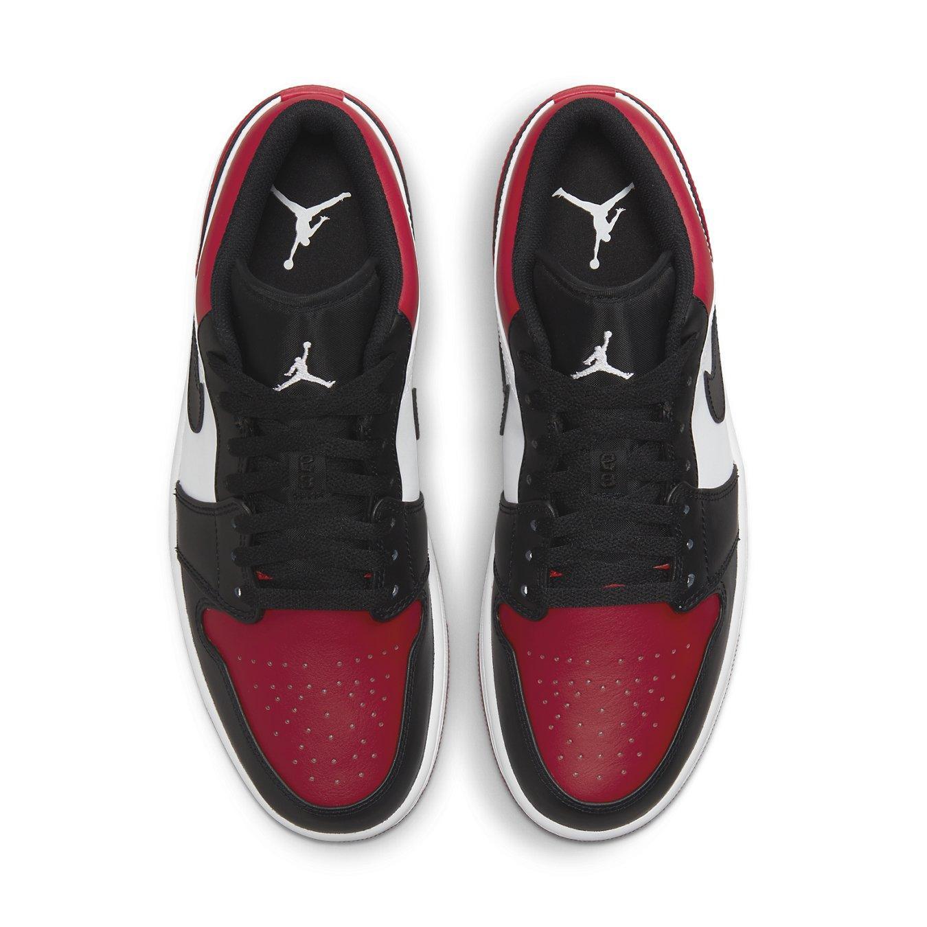 Top view of Jordan 1 Low "Bred Toe" sneakers featuring black and red leather design with white accents.