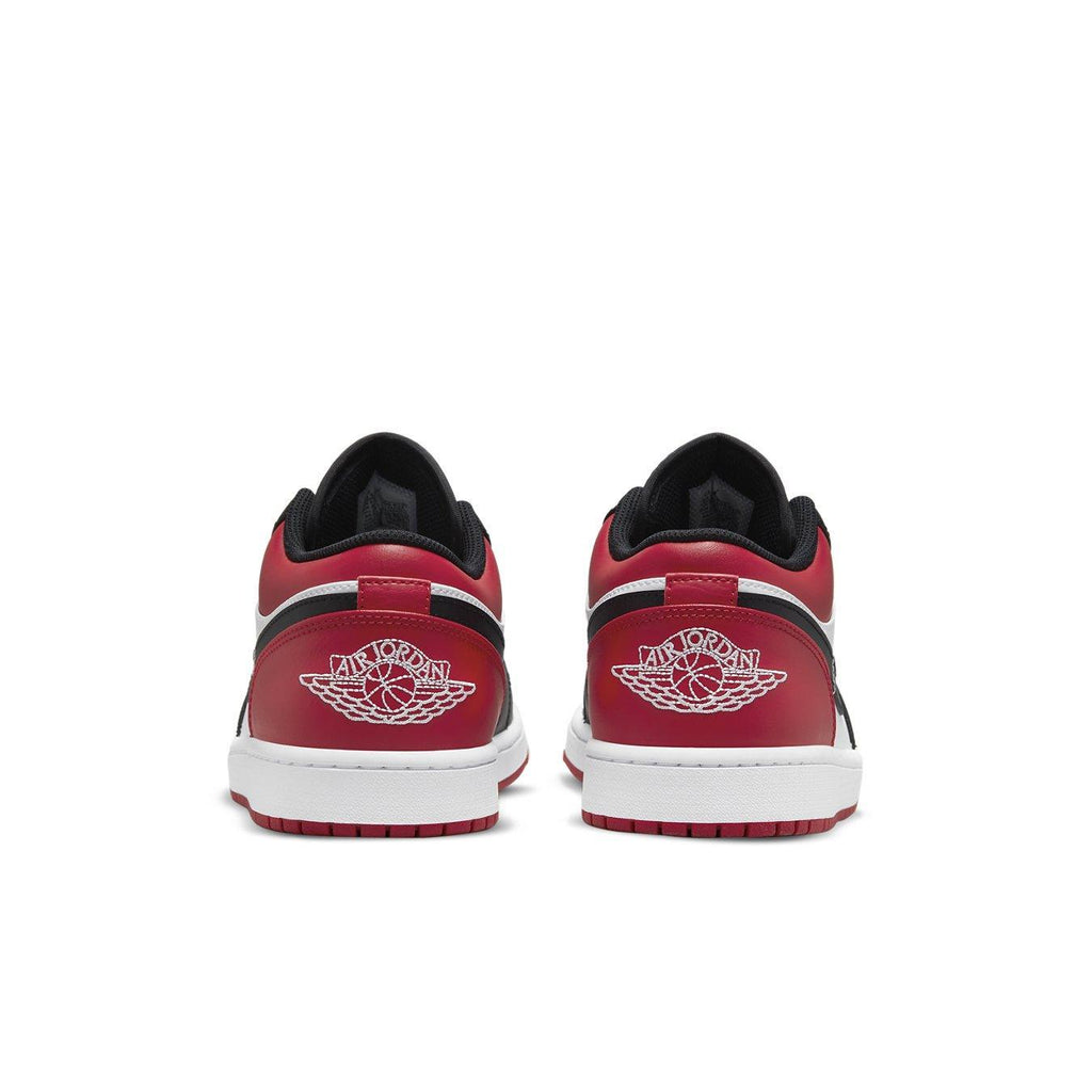 Retro Air Jordan 1 Low Bred Toe sneaker rear view showcasing red and black design with Wings logo.