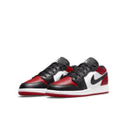 Jordan 1 Low Bred Toe GS sneakers in black, red, and white leather design.