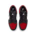 Jordan 1 Low Bred Toe (GS) sneakers featuring red, black, and white colorway with iconic Air Jordan logo.