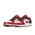 Nike Air Jordan 1 Low Bulls in white, red, and black leather with stylish design and rubber sole.