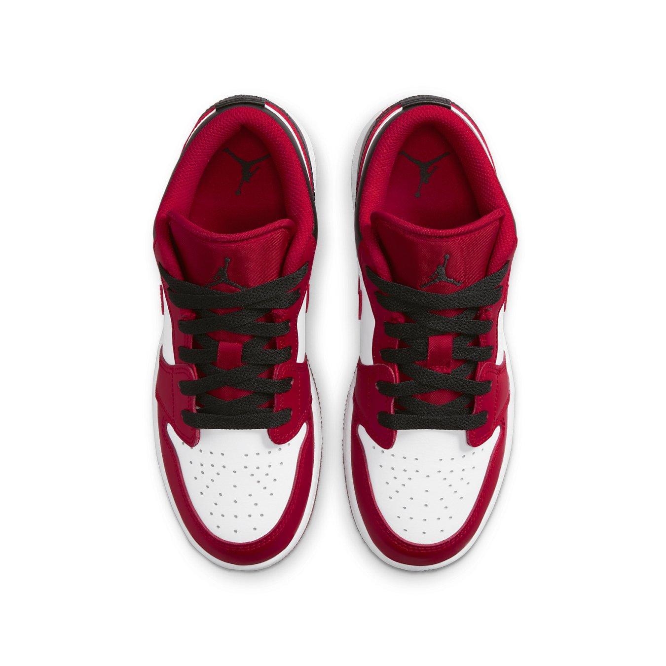 Air Jordan 1 Low Bulls GS sneakers in white and Gym Red, featuring black laces, top view.