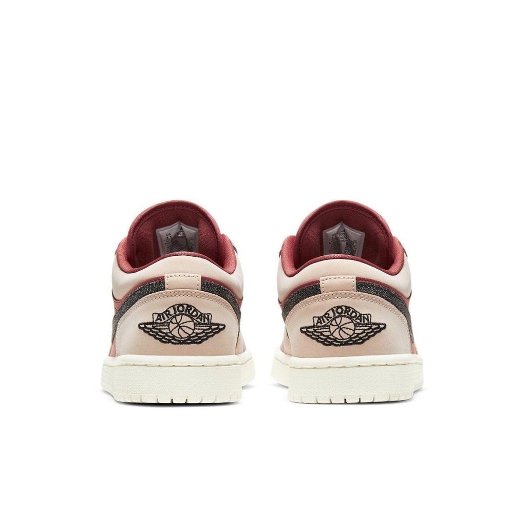 Back view of women's Air Jordan 1 Low Canyon Rust sneakers with muted tan and rich rust accents.