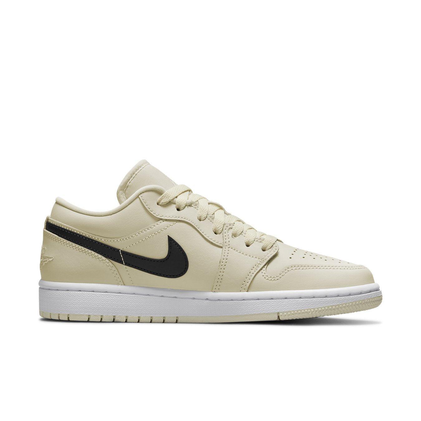 Air Jordan 1 Low Coconut Milk women's sneakers with cream upper and black swoosh.