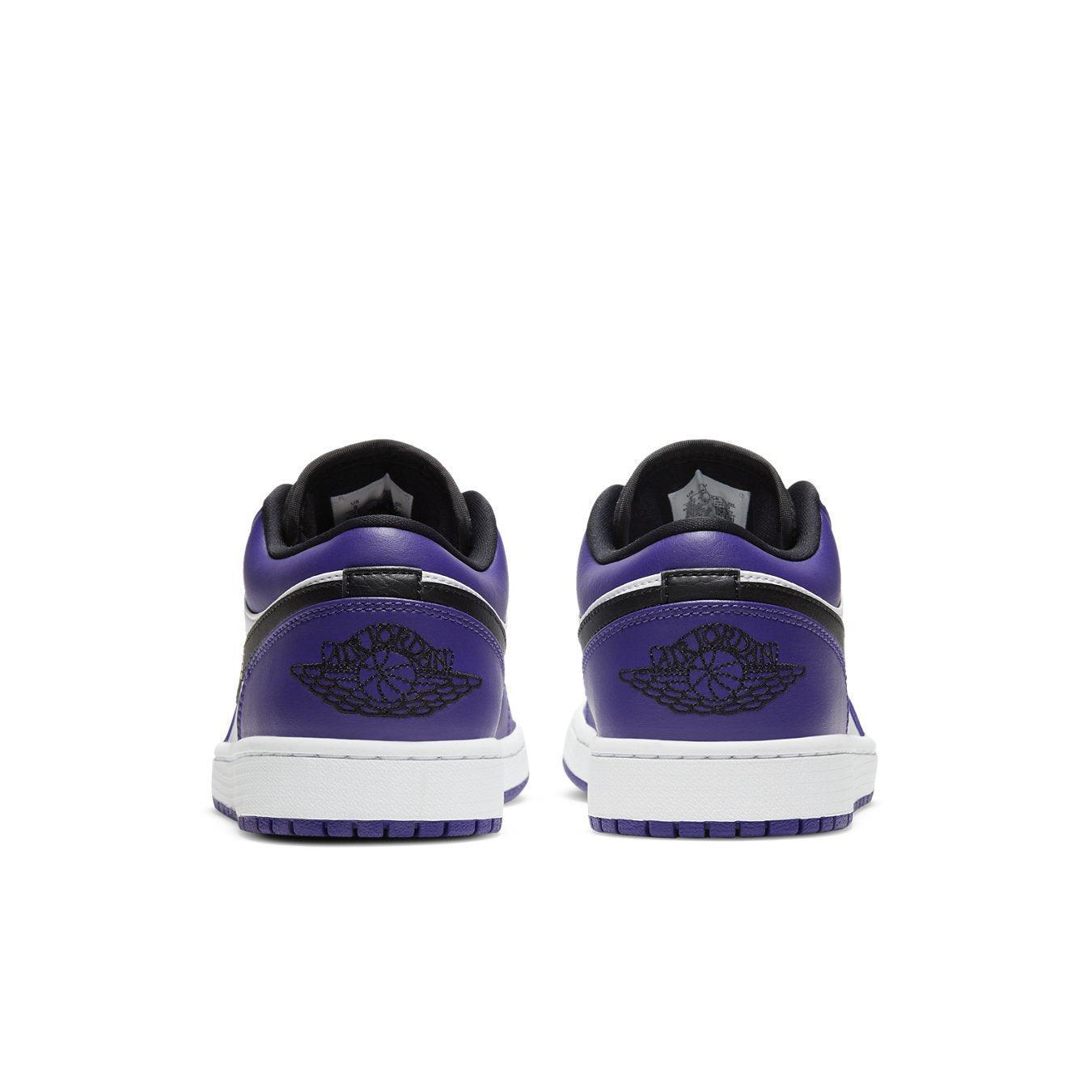 Jordan 1 Low Court Purple White sneakers featuring purple overlays and classic white leather base from the back view.
