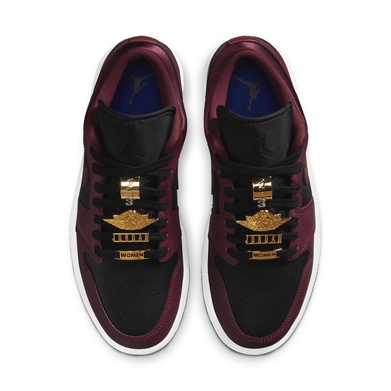 Jordan 1 Low Dark Beetroot Black for women, featuring black and dark beetroot leather with gold accents.