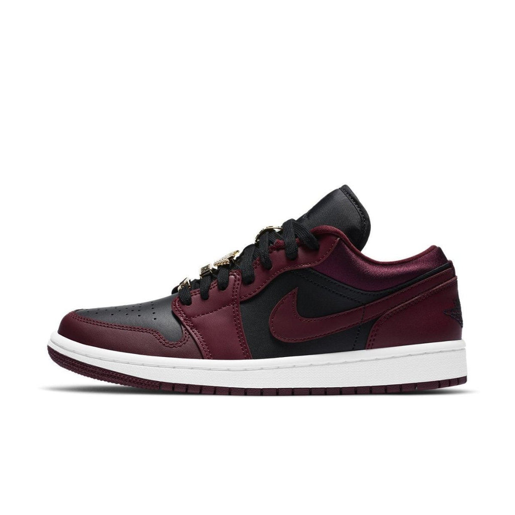Jordan 1 Low Dark Beetroot Black women's sneakers featuring smooth leather, black toe, and striking beetroot accents.