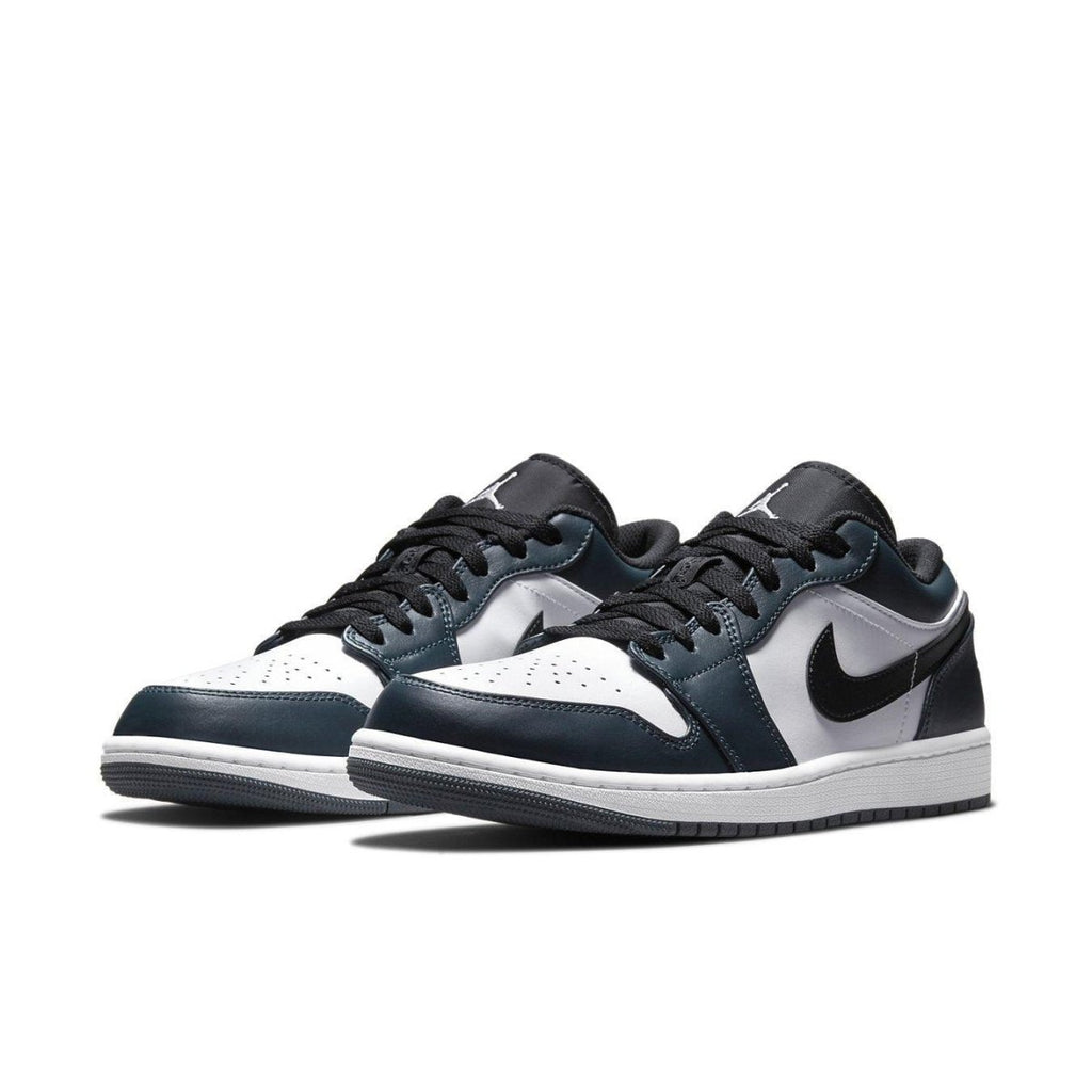 Air Jordan 1 Low Dark Teal sneakers in white leather with dark teal overlays and black Swoosh, laces, and lining.