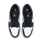 Air Jordan 1 Low Dark Teal sneakers featuring white leather and black Swooshes, perfect for casual style.