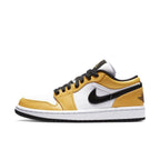 Nike Air Jordan 1 Low Laser Orange women's sneaker with white and yellow upper and black accents.