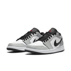 Air Jordan 1 Low Light Smoke Grey sneaker featuring grey and black accents, stylish design and premium materials.