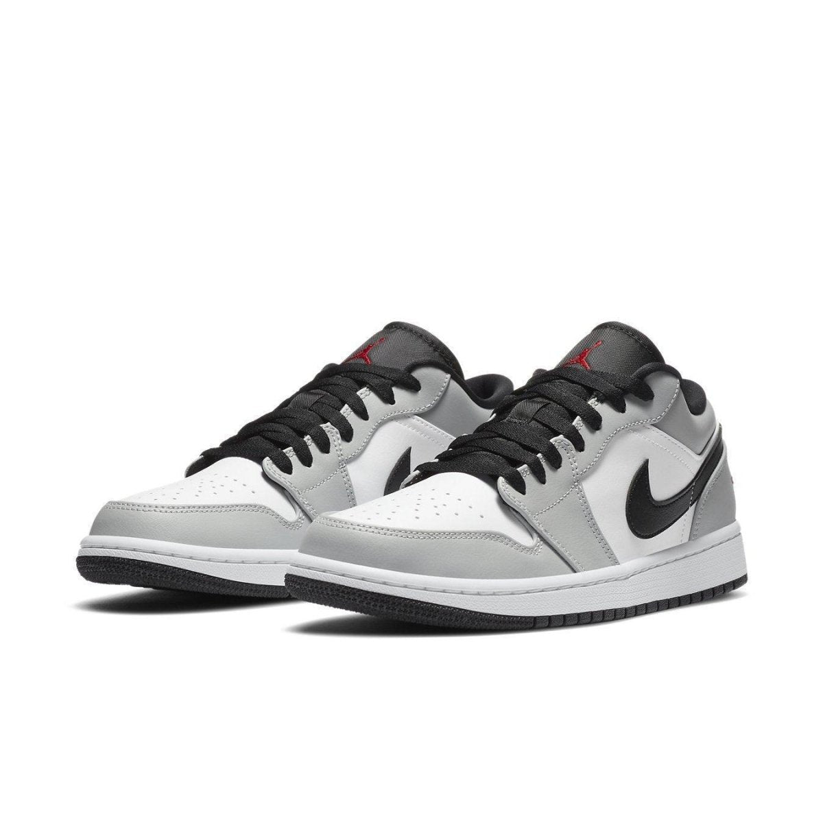 Air Jordan 1 Low Light Smoke Grey sneaker featuring grey and black accents, stylish design and premium materials.