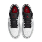 Top view of Air Jordan 1 Low Light Smoke Grey sneakers featuring grey, white, and red accents for a stylish look.