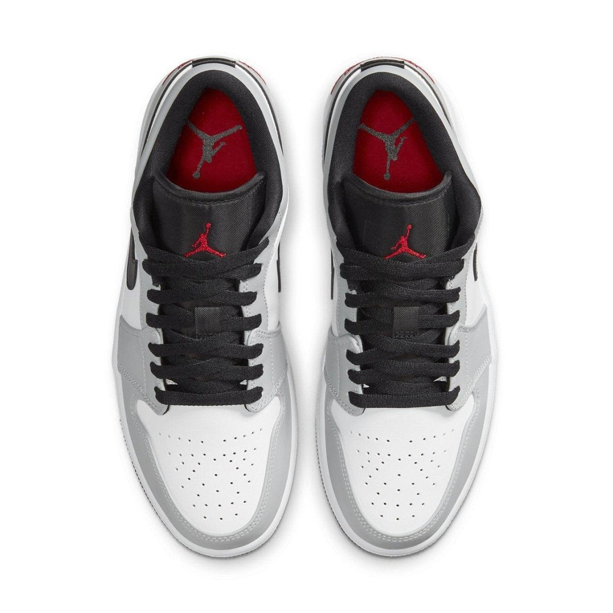 Top view of Air Jordan 1 Low Light Smoke Grey sneakers featuring grey, white, and red accents for a stylish look.