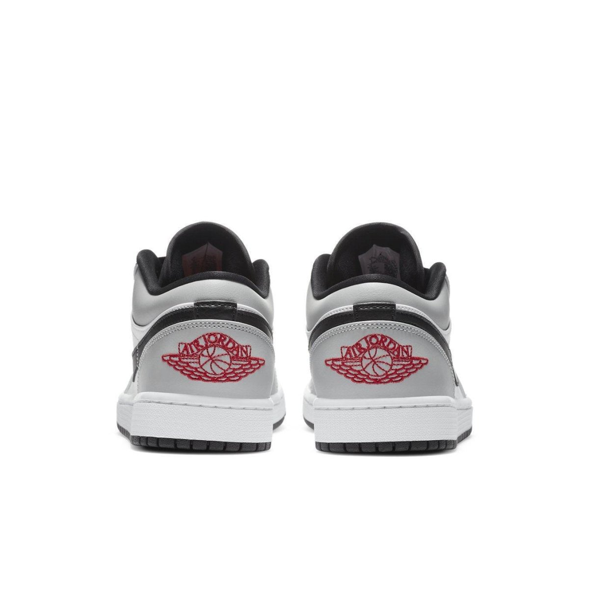 Back view of Jordan 1 Low Light Smoke Grey sneakers showcasing iconic logo and sleek design.