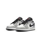 Air Jordan 1 Low GS Light Smoke Grey sneakers featuring gray and white colorway with premium materials.