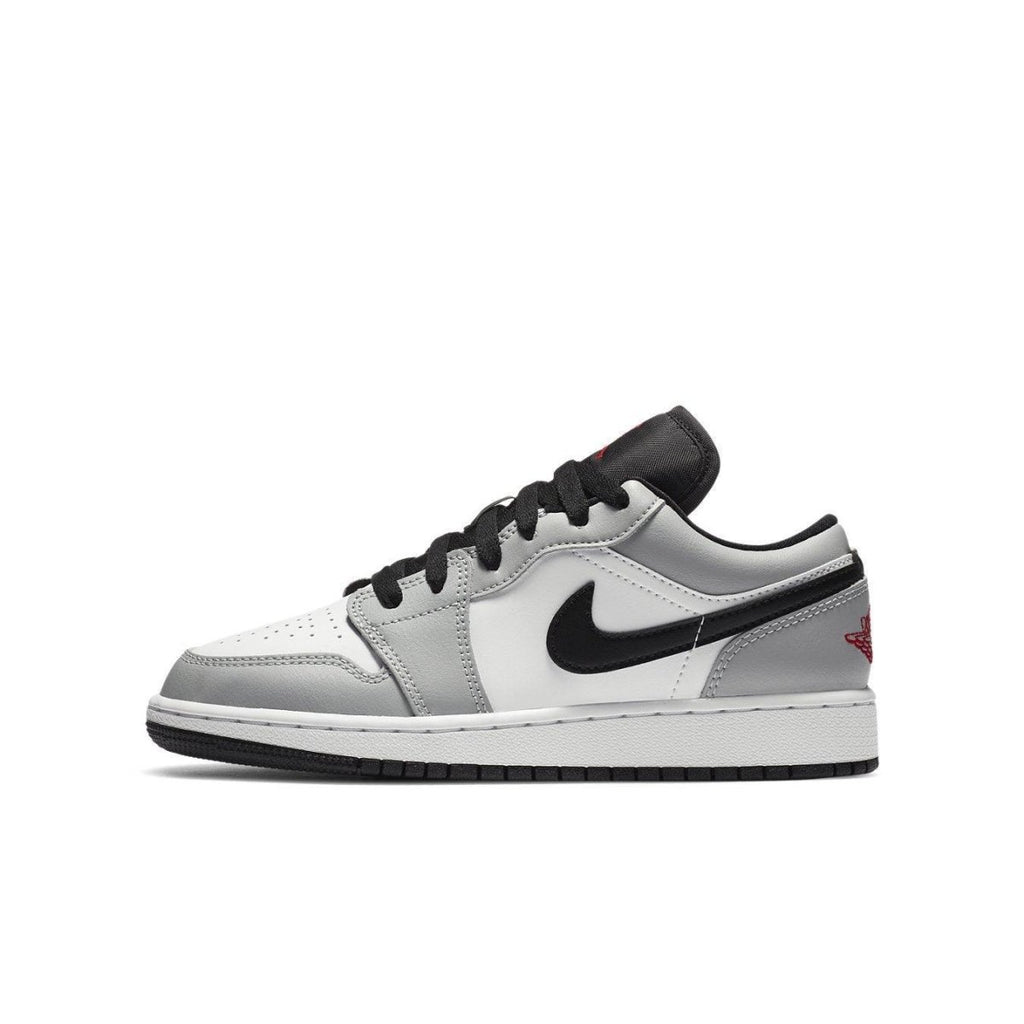 Jordan 1 Low Light Smoke Grey GS sneakers featuring premium materials and a stylish design.