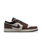 Nike Air Jordan 1 Low Mocha featuring brown suede and white leather upper with black and pink accents.