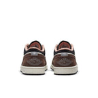 Rear view of Air Jordan 1 Low Mocha featuring brown suede, white leather, and pink lining details.
