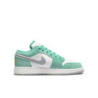 Jordan 1 Low SE GS New Emerald sneaker featuring white leather and aqua green suede with a grey Swoosh.