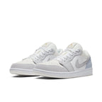 Jordan 1 Low Paris sneakers featuring light grey, white, and blue colorway, inspired by Parisian architecture.