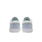 Back view of Air Jordan 1 Low Paris sneakers showcasing soft blue and white design.