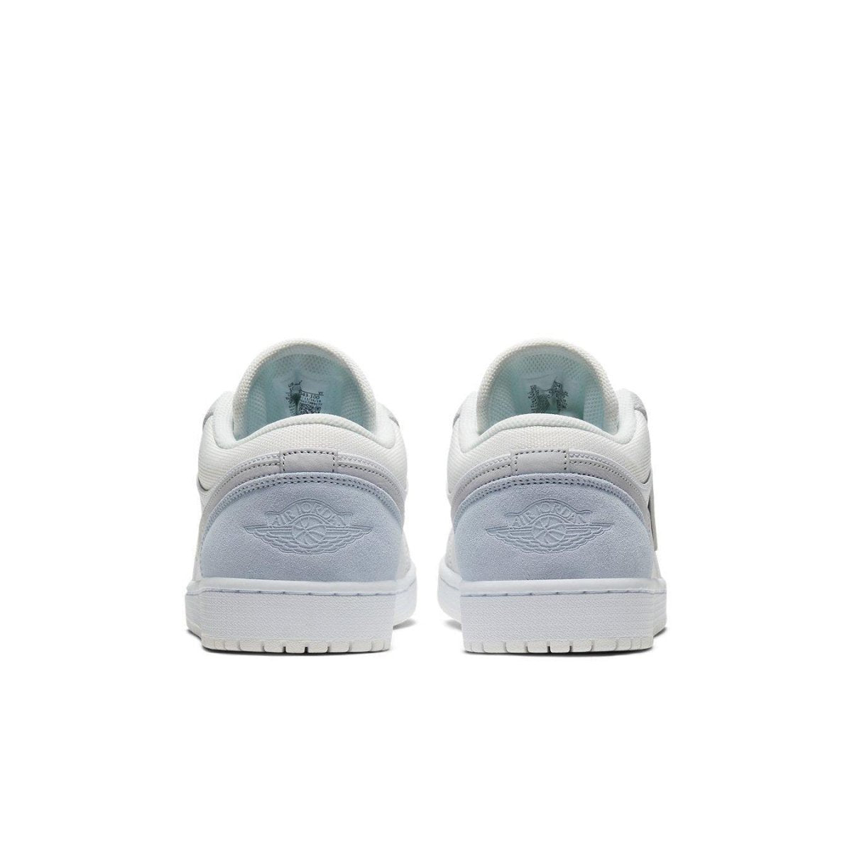 Back view of Air Jordan 1 Low Paris sneakers showcasing soft blue and white design.