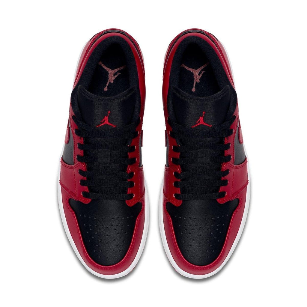 Top view of Air Jordan 1 Low Reverse Bred featuring black and red leather upper with perforated toe box and iconic Swoosh.
