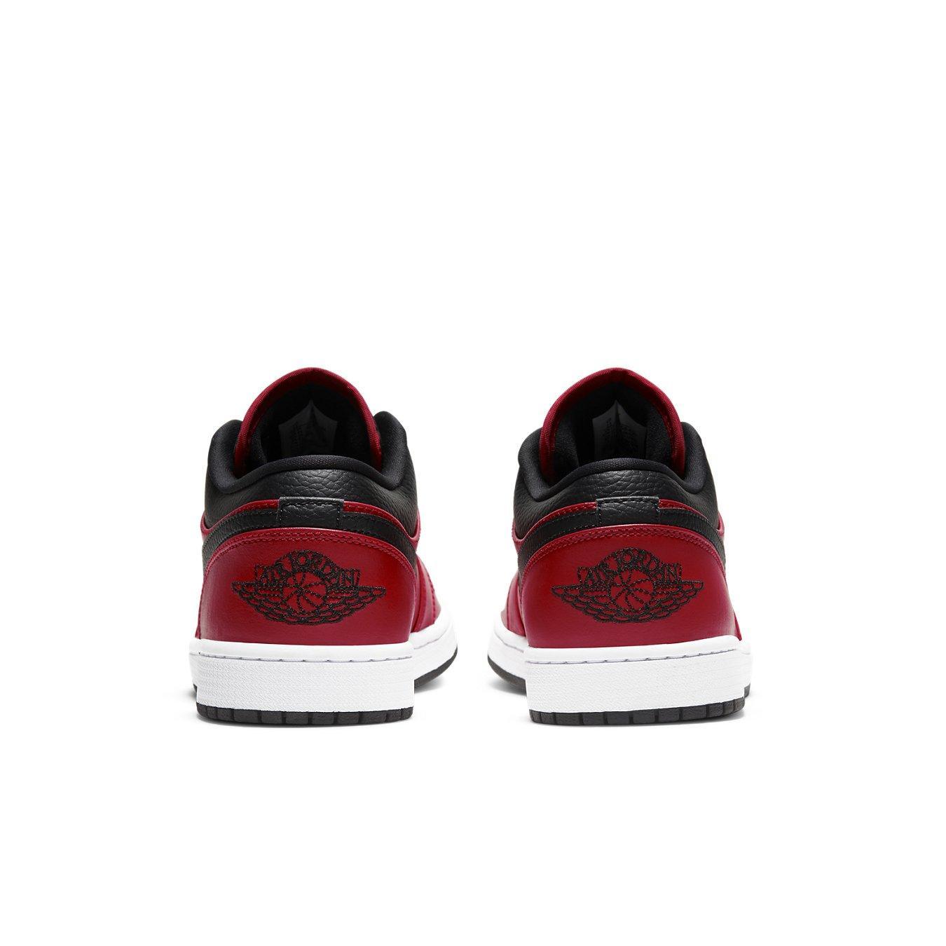 Back view of Jordan 1 Low Reverse Bred sneakers featuring red and black colors, inspired by Chicago Bulls design.