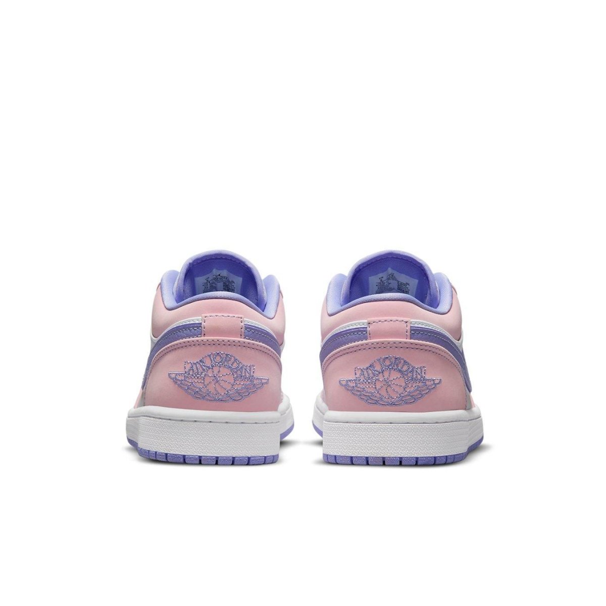 Back view of Jordan 1 Low SE Arctic Punch sneakers in pink and purple with layered Swoosh and smooth leather.