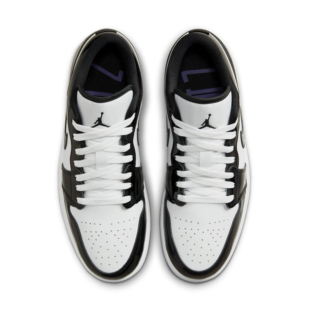 Nike Air Jordan 1 Low SE Concord sneakers featuring a white leather base with black accents and purple detailing.