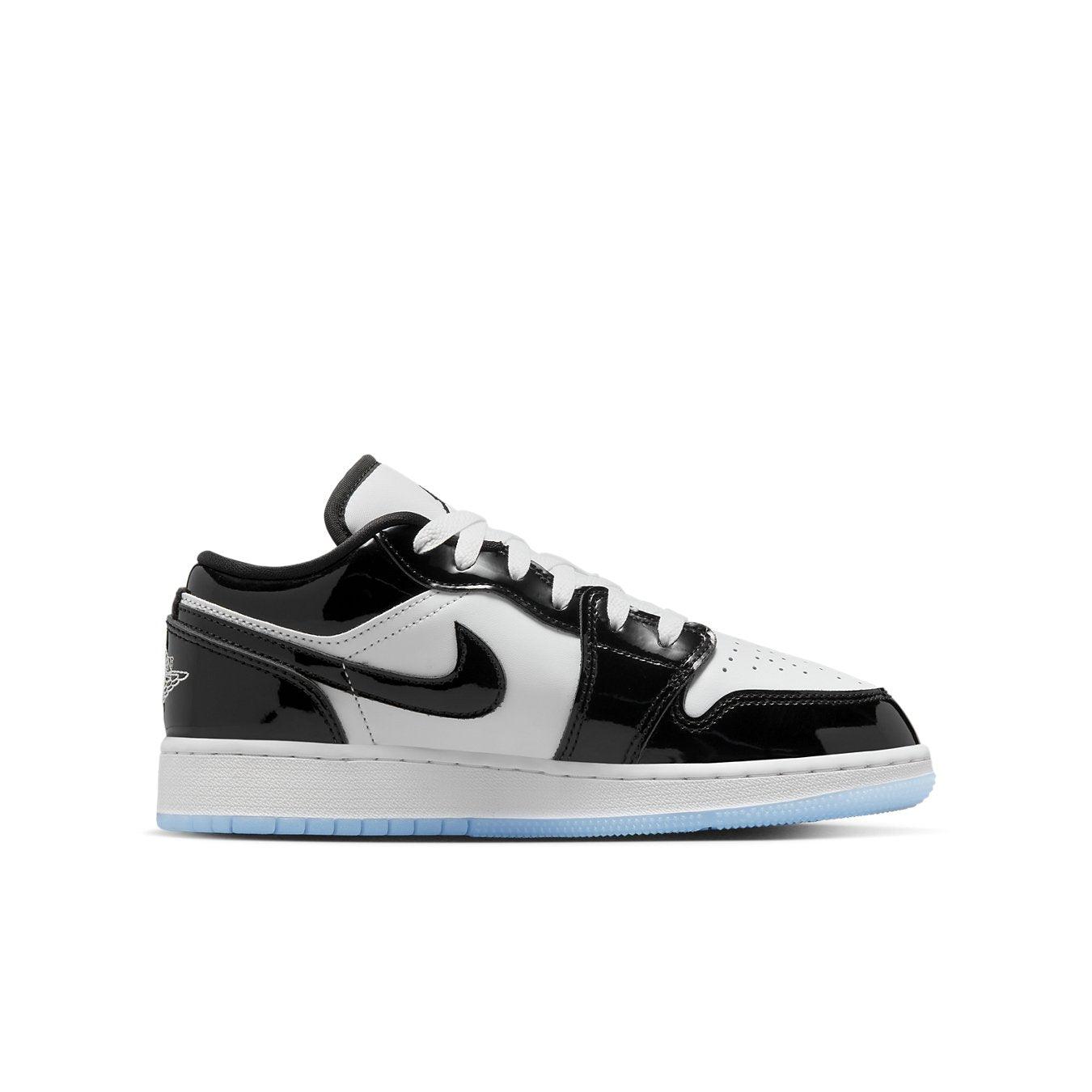 Jordan 1 Low SE Concord GS sneaker featuring black patent overlays and smooth white leather.