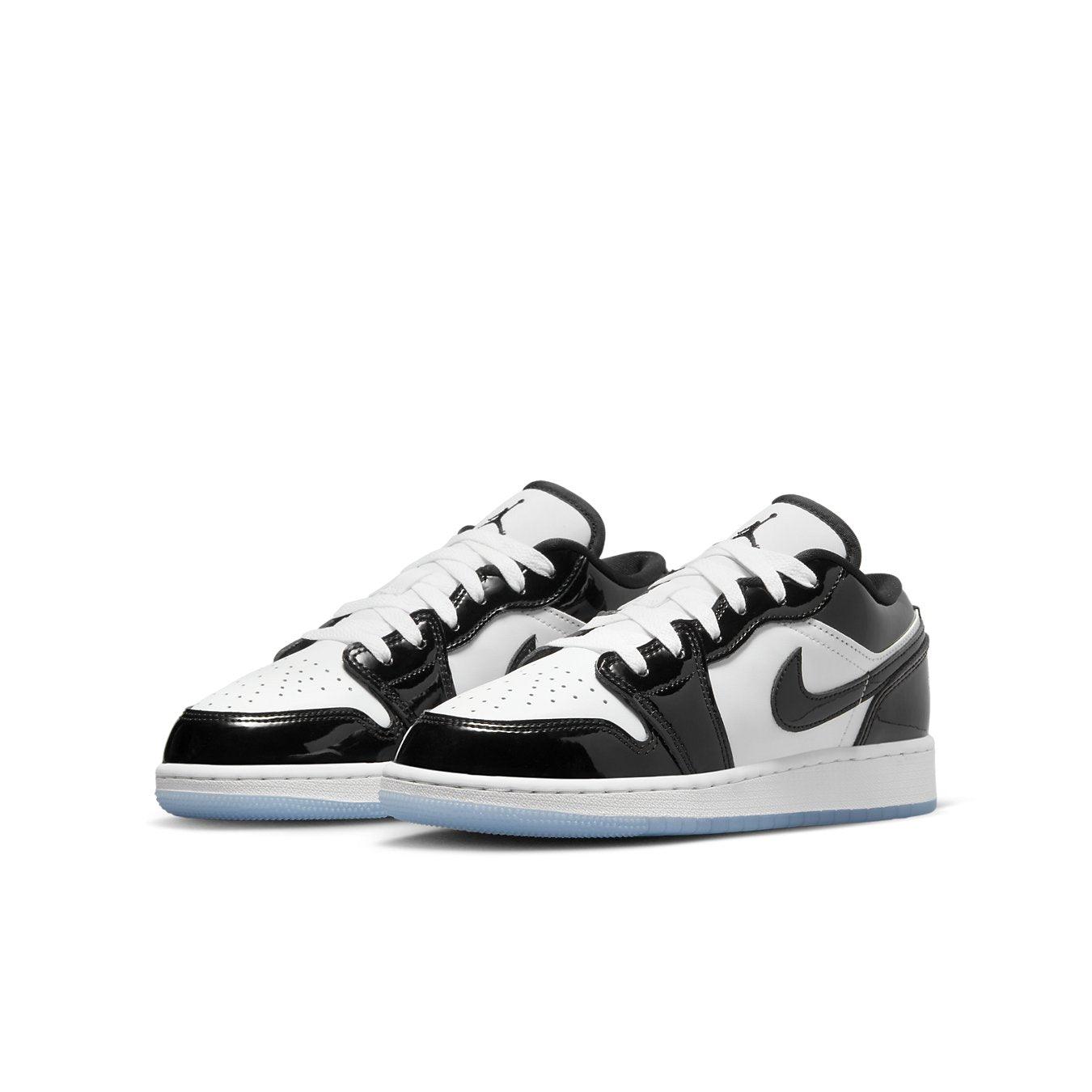 Jordan 1 Low SE Concord GS sneakers in black and white leather with glossy patent detailing.
